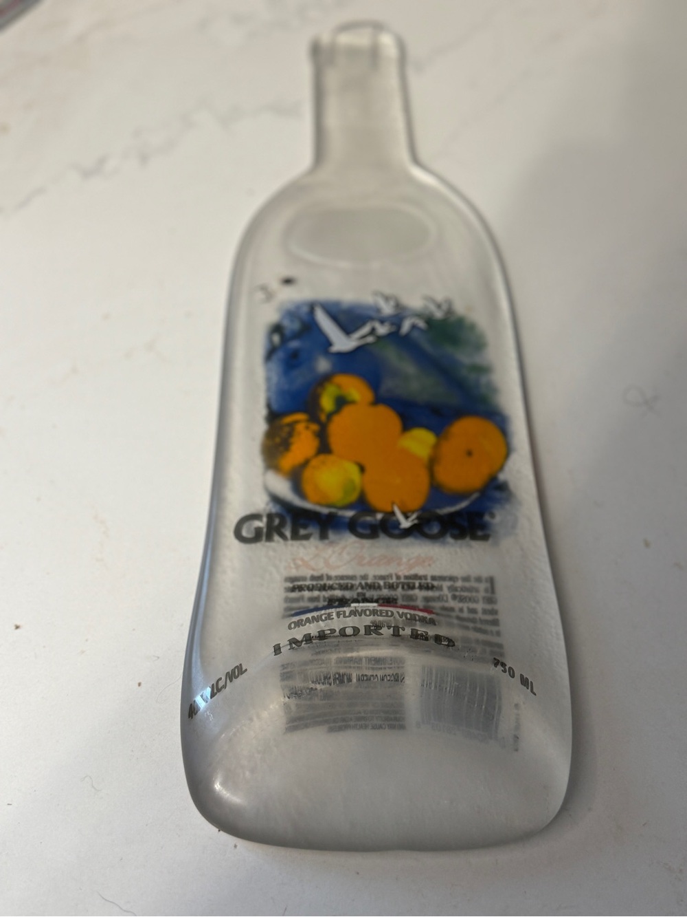 Grey Goose L’Orange melted Bottle Serving Tray - spoon rest